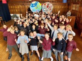 cottesmore school cott 27 2022 the sussex schools sustainability summit switch off climate change pupils in hall cheering