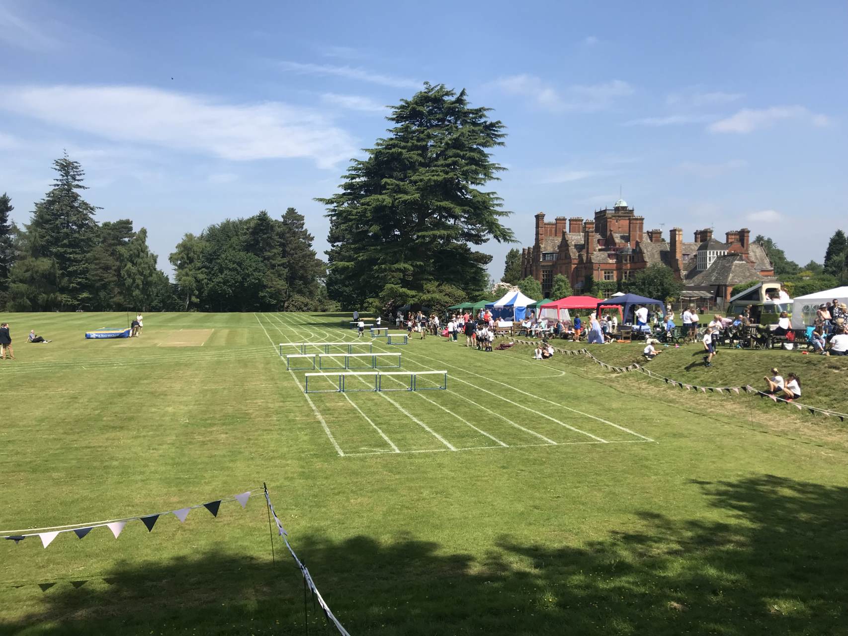 cottesmore school ariel view of outside sports field pitch with hurdles for sports day