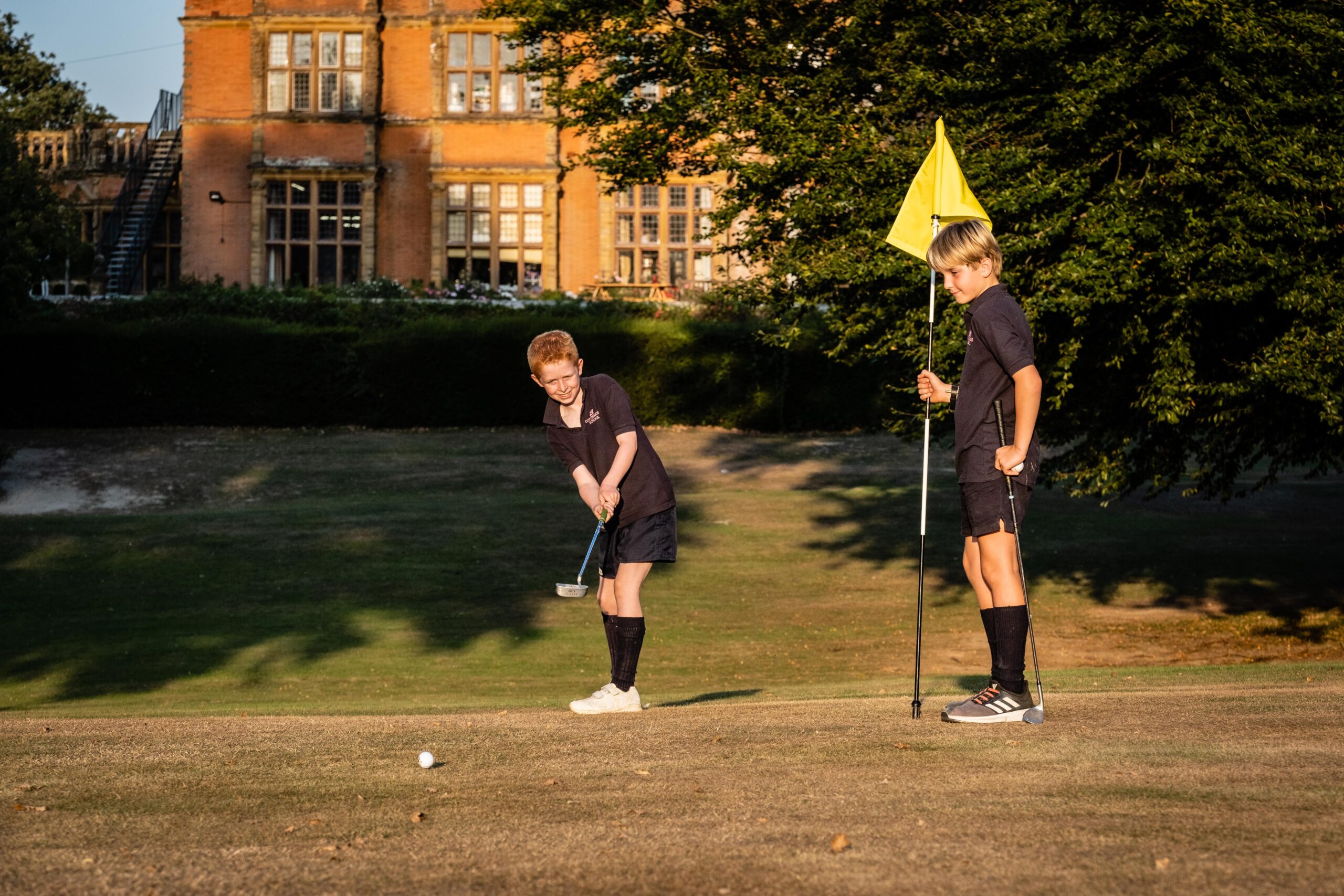 Cottesmore school children playing golf autumnal shot