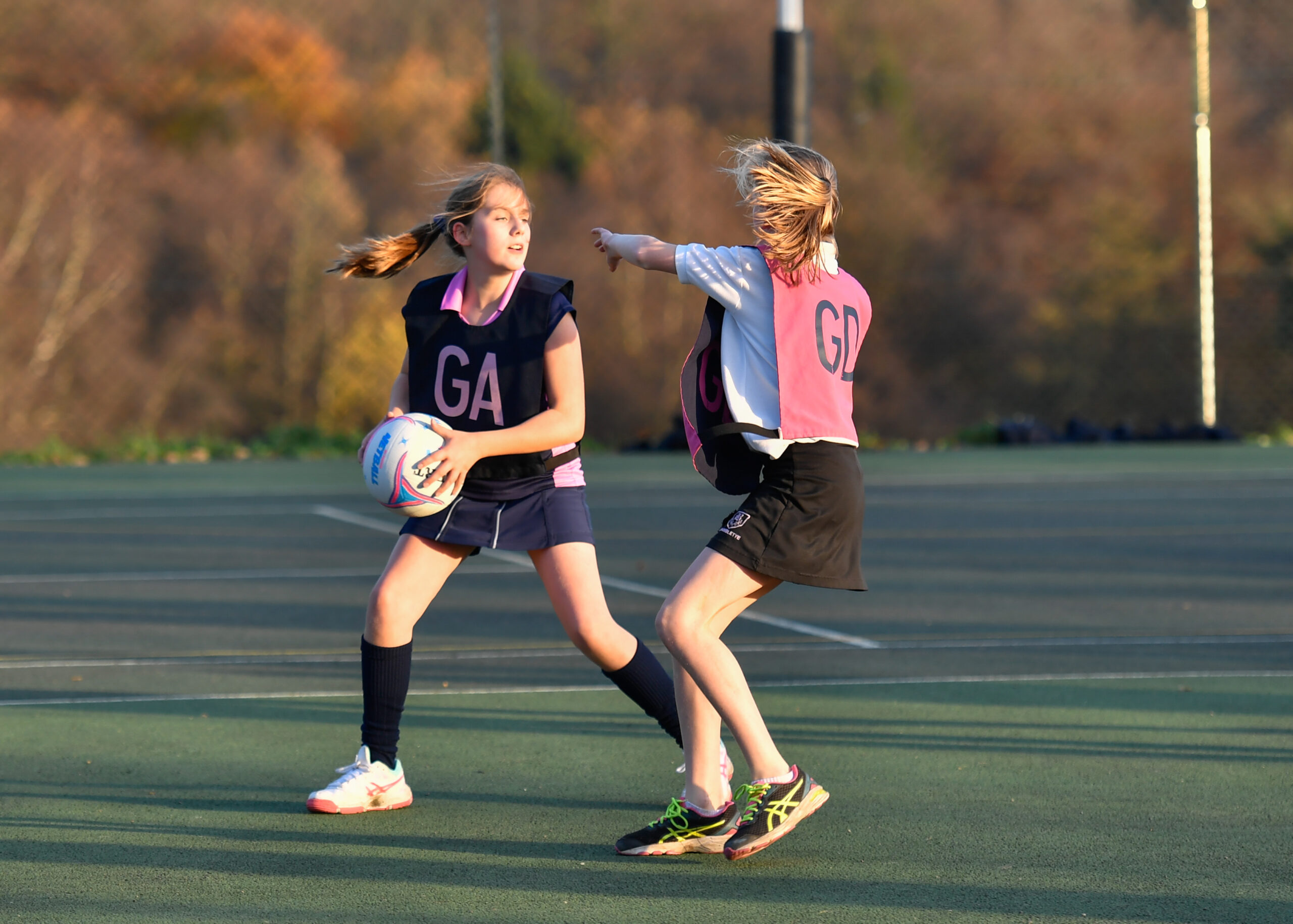 Cottesmore School female pupils playing netball